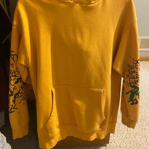 Yellow forever 21 hoodie with writing on the sleeves